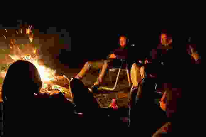 A Group Of People Gathered Around A Campfire, Their Faces Illuminated By The Flickering Flames, Engaged In A Discussion About The Unsolved Mystery. The Boot Under The Bush (The Boot Mystery 1)